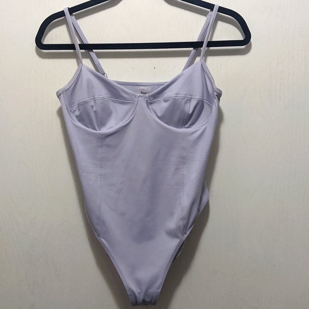 TNA baby blue bodysuit
